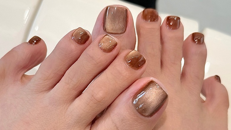 Feet with a gingerbread-inspired manicure