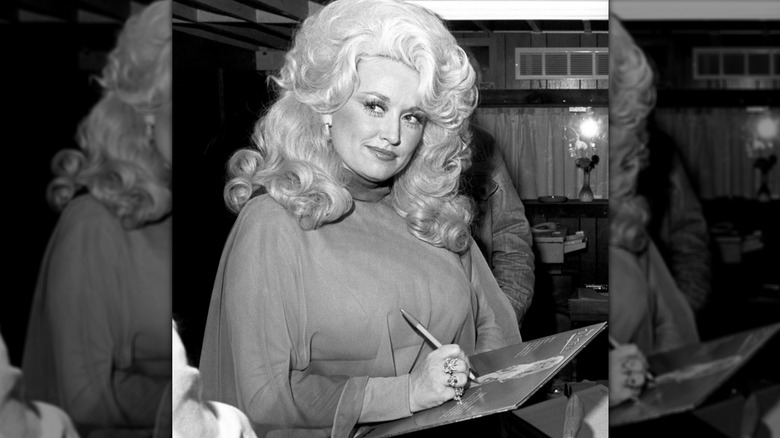Dolly Parton signing a record