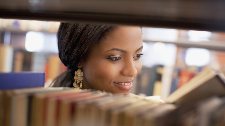 Woman looking at books