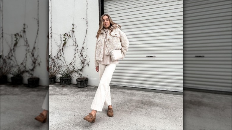 Woman wearing a jacket and loafers