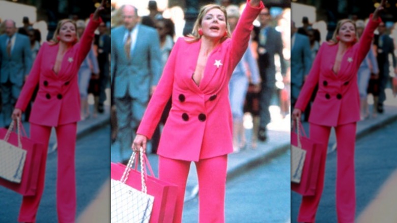 Kim Cattrall as Samantha Jones wearing a pink suit