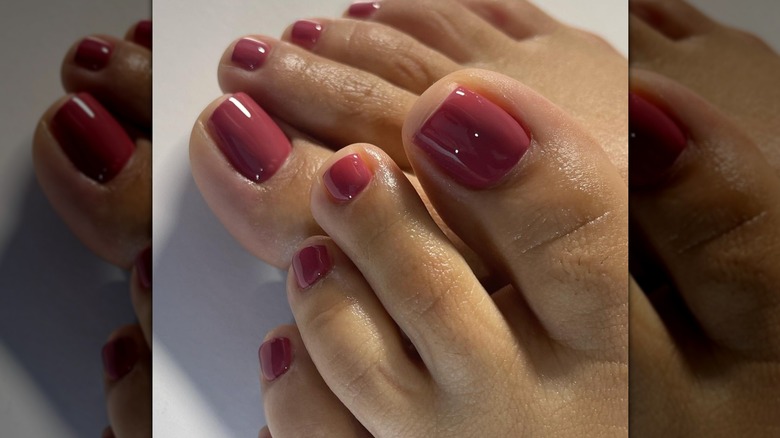 A close up of a dusty rose pedicure on Instagram