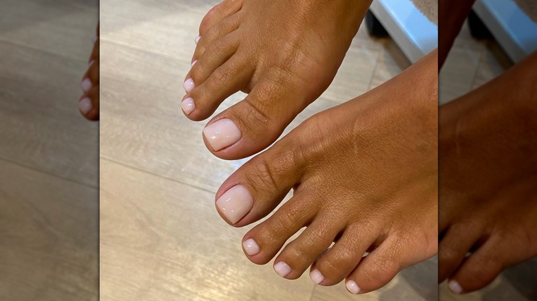 A woman with a baby pink pedicure on Instagram