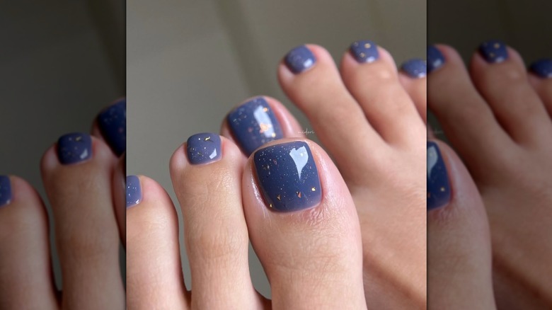 A woman with pale blue toes with gold flecks on Instagram