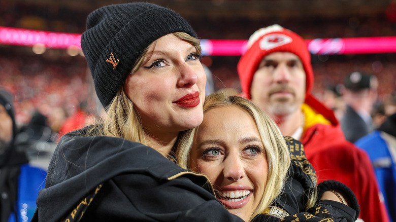 Taylor Swift hugging Brittany Mahomes on the football field in 2025