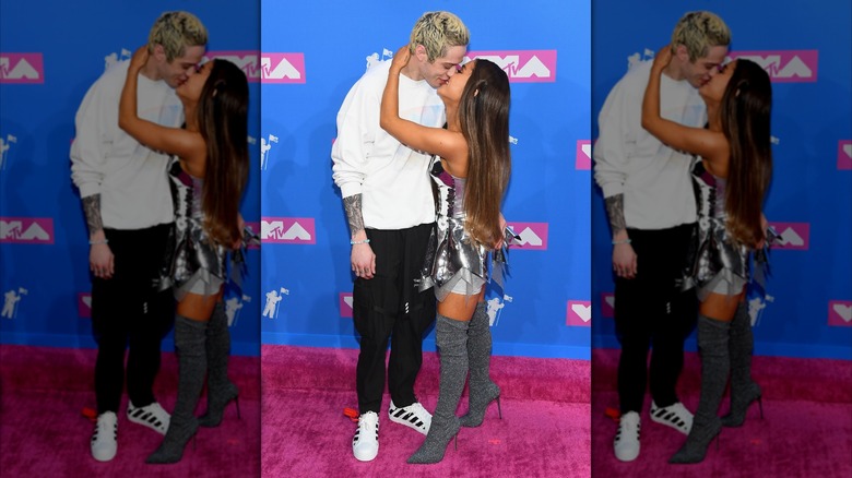 Pete Davidson and Ariana Grande kissing on the red carpet at the MTV VMAs