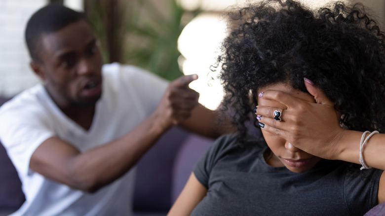 Man pointing at a woman
