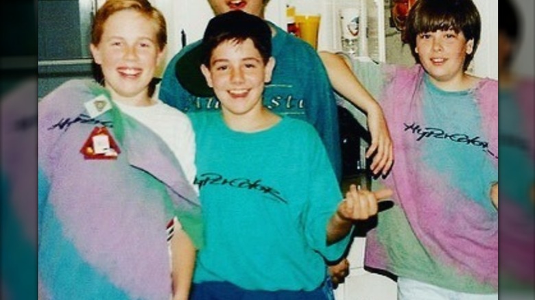 A group of teenage boys wearing Hypercolor t-shirts