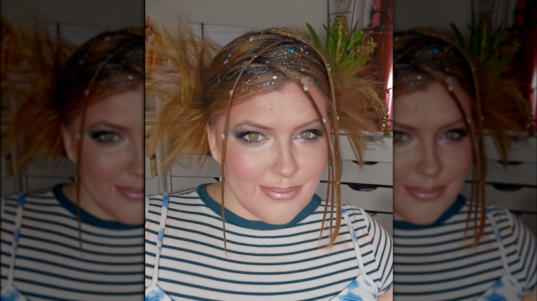 A woman on TikTok with face framing tendrils
