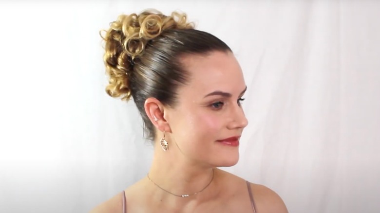 A woman on YouTube with a '90s prom bun