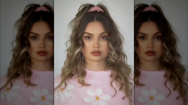 A woman on TikTok with her hair half up and half down