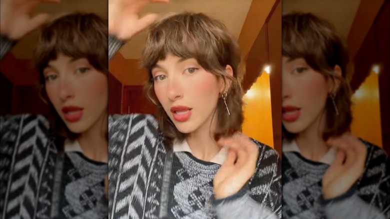 A woman on TikTok showing a modern mullet