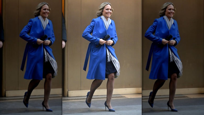 Dylan Dreyer walking in a skirt, a bright blue coat, and light gray scarf at the NBC "Today" show at Rockefeller Plaza
