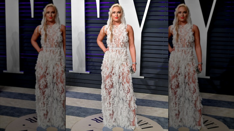 Lindsey Vonn wearing a sheer white dress at the Vanity Fair party in 2019