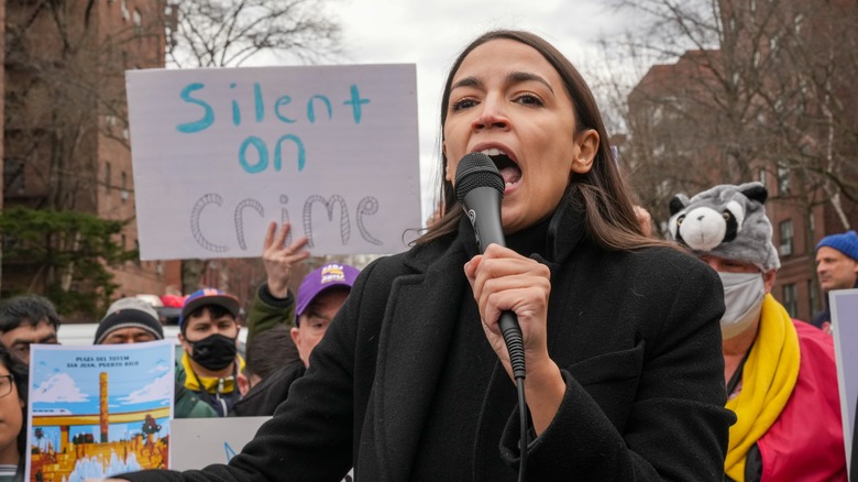 Alexandria Ocasio-Cortez marching with people