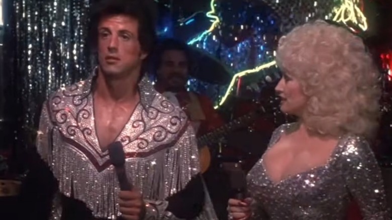 Sylvester Stallone and Dolly Parton in the movie "Rhinestone"