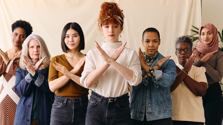 Group of women crossing their arms