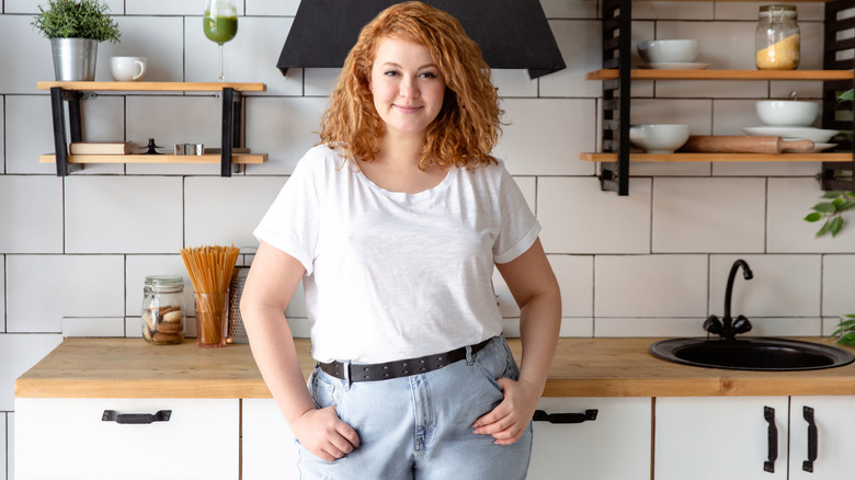 Woman standing in kitchen 