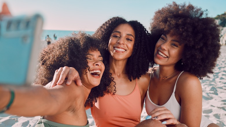 Women taking a selfie on the beach