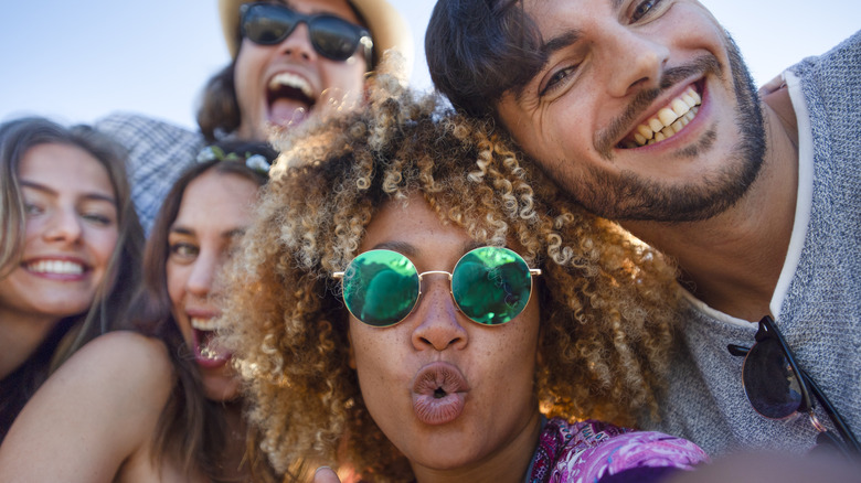 Group of friends taking a selfie outside