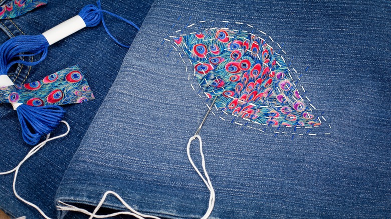 Peacock patchwork on jeans