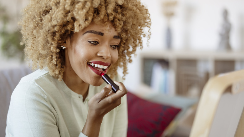 Woman applying makeup