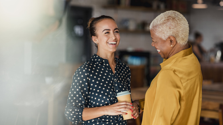 Two women communicating and smiling