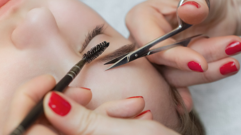 Cutting eyebrows