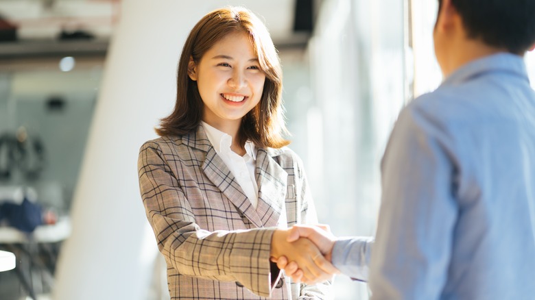 Woman shaking hands