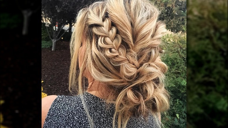 Braided messy bun back of woman's head