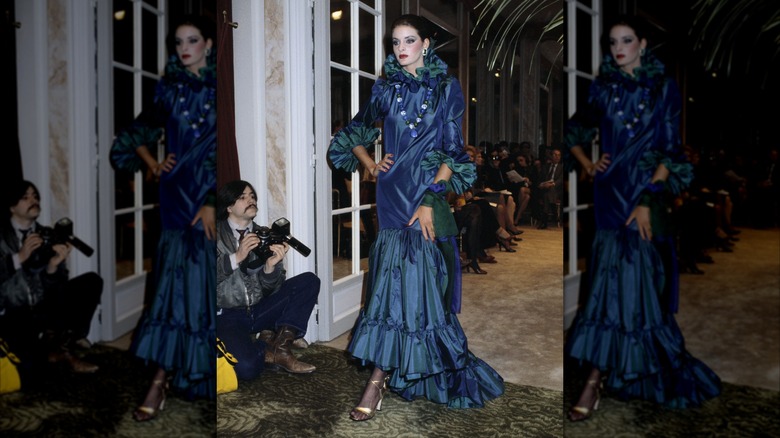 A model wearing a ruffled dress during a fashion show