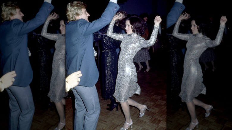 A woman dancing in a sequin dress at Studio 54