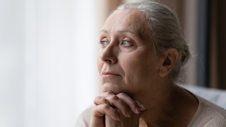 Woman worrying alone at home 