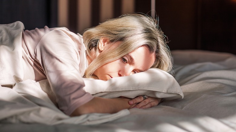 Depressed woman in bed 