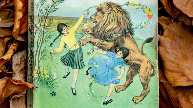 The Lion, the Witch and the Wardrobe book laying in a bed of orange leaves