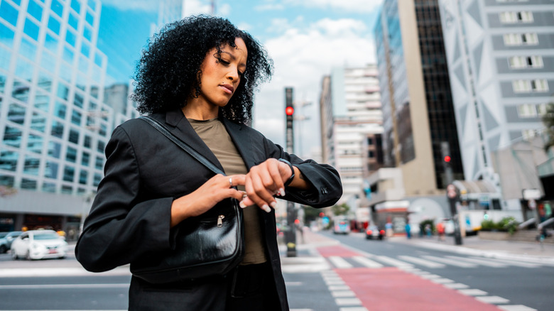 A woman looking at her watch