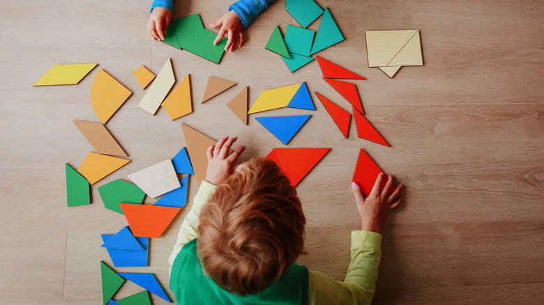 A child playing with shapes