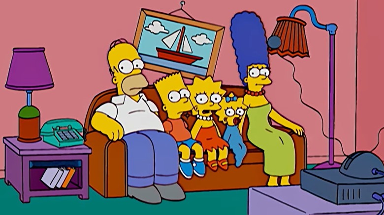 The Simpsons sitting on the couch together