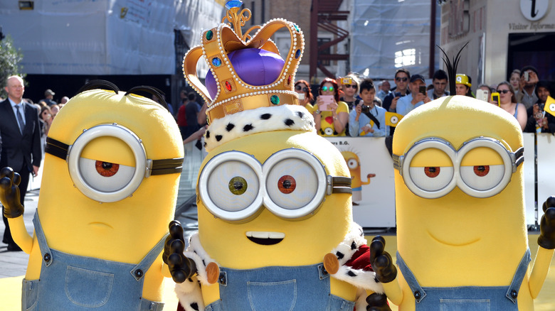 Three minions on the red carpet at the Minions premiere