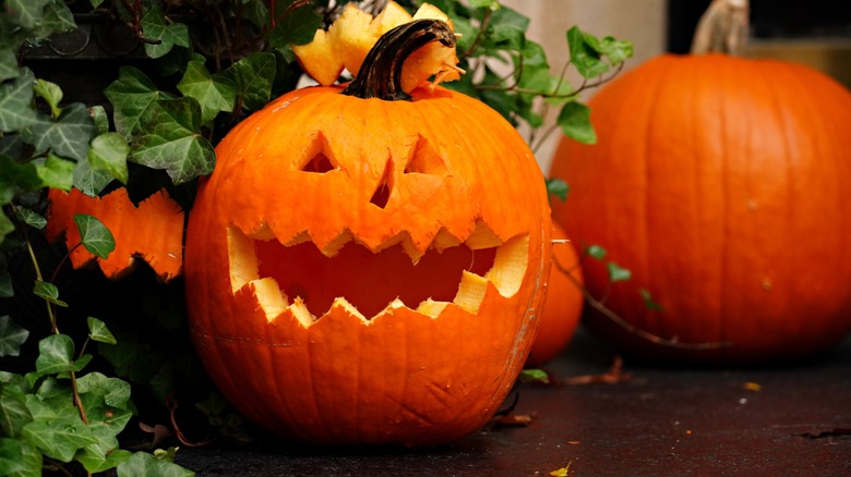 A pumpkin carved with a face for Halloween