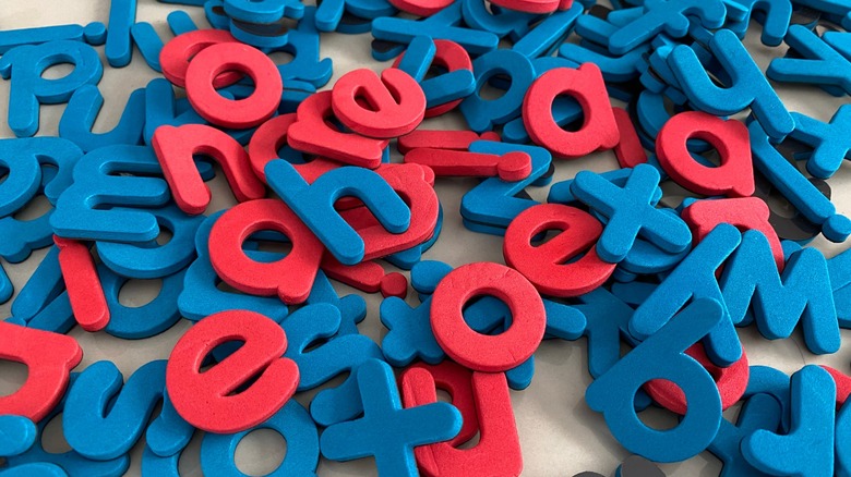 A collection of letters with the vowels in red and consonants in blue
