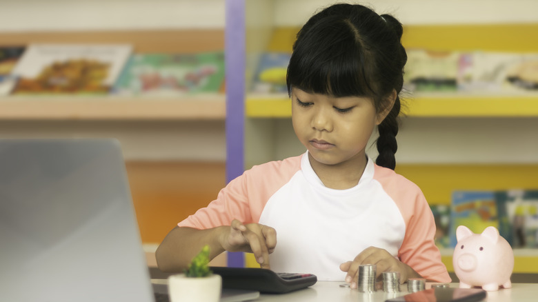 Kid using a calculator