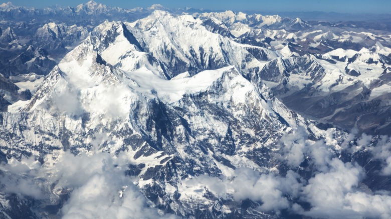 An aerial view of Mount Everest in the clouds