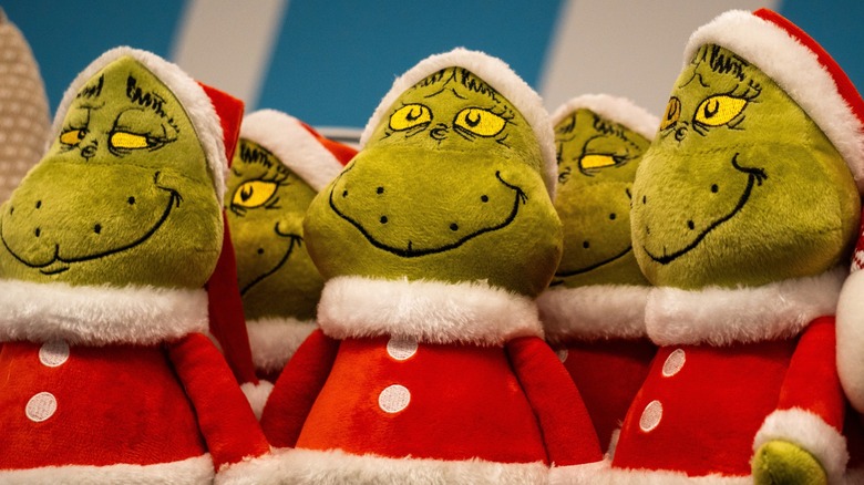 A selection of Grinch plushes