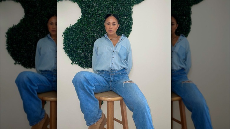 A woman wearing double denim