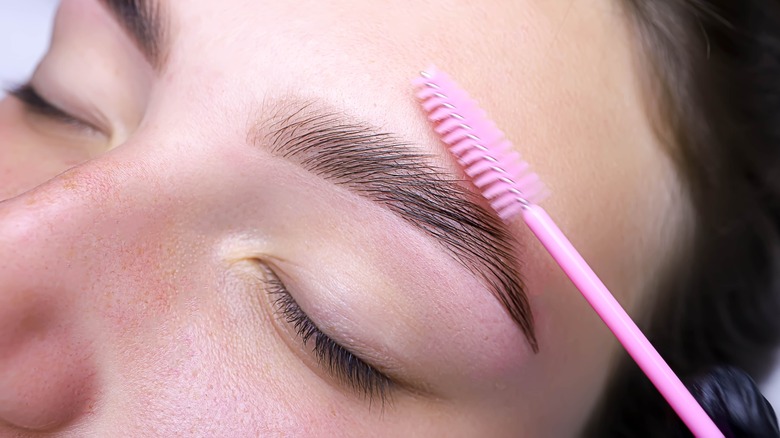 Brushing an eyebrow