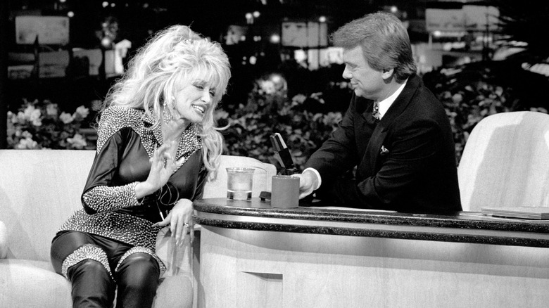 A black and white photo of Dolly Parton on The Pat Sajak Show