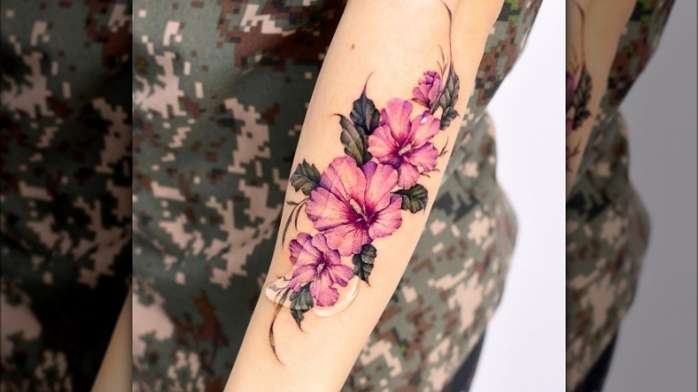Hibiscus arm tattoo