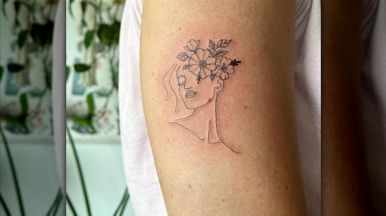 Floral head line tattoo