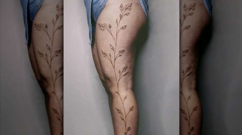 Large vine leg tattoo